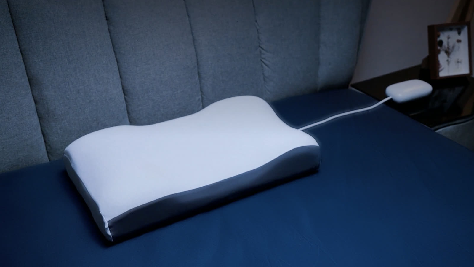 Sleepria pillow in a calm, softly lit bedroom