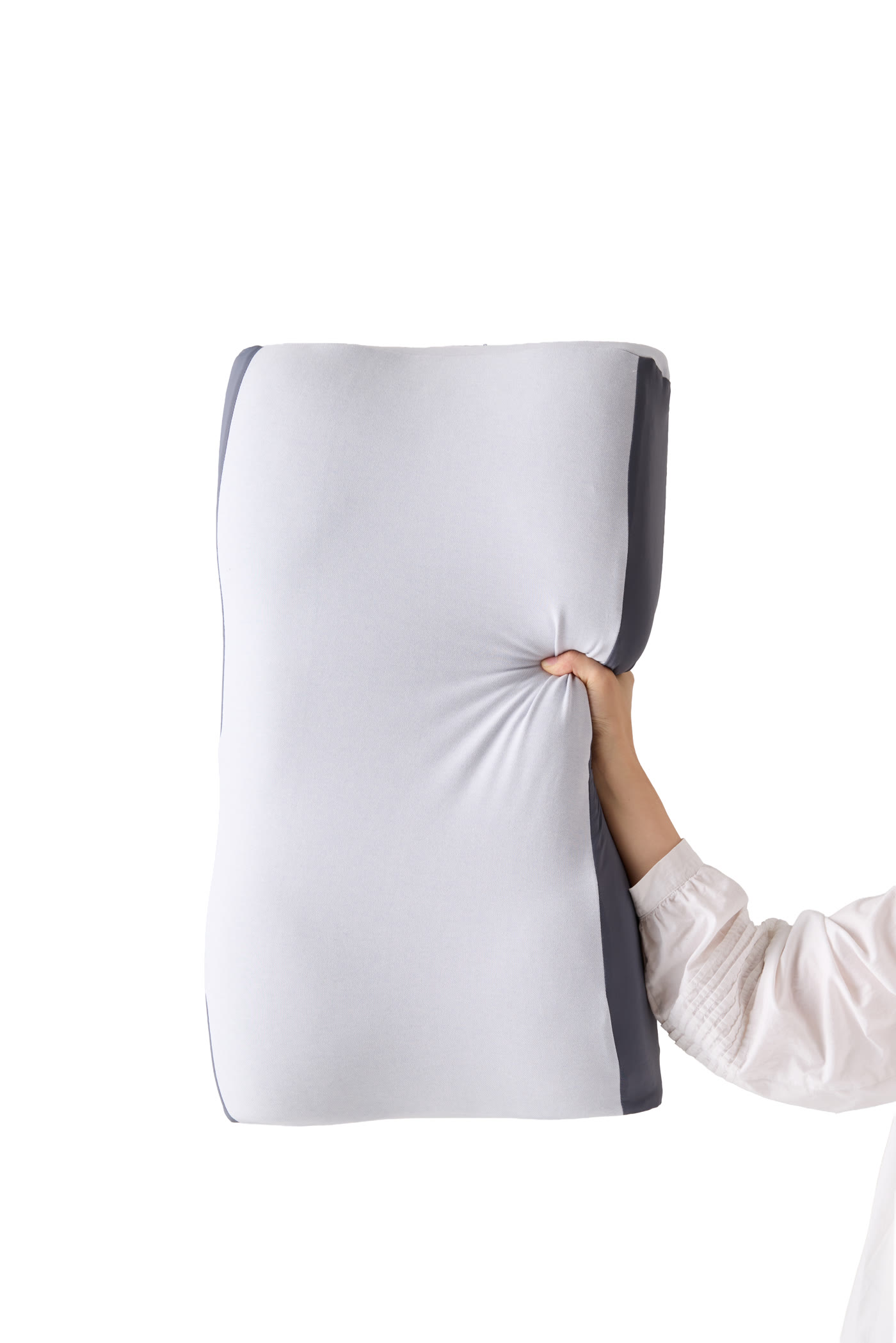 The soft pillow compressing in a gentle squeeze